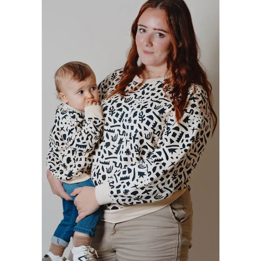 YOU&MILK VOEDINGSSWEATER GEOMETRIC ZWART